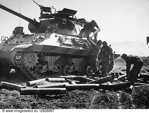 KOREAN WAR: LOADING TANK. Soldiers of the 9th ROK Division reload a tank during the battle of White Horse Mountain,  October 1952.
