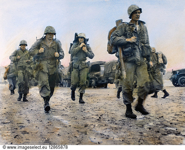 KOREAN WAR: MARINES  1953. U.S. Marines in Korea heading for helicopters to take them to the front  March 1953. Oil over a photograph.