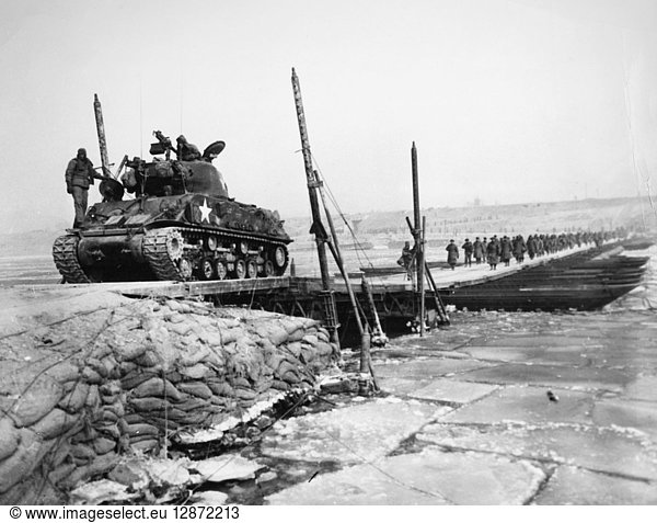 KOREAN WAR: RETREAT  1951. U.S. infantrymen and a tank crossing the Han River by pontoon bridge in the retreat from Seoul  early January 1951.