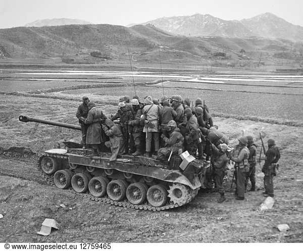 KOREAN WAR: TANK. A tank being used to transport troops.