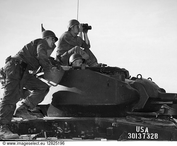 KOREAN WAR: TANK 1952. Men of the 102nd Armored Cavalry Regiment New Jersey National Guard watch for result of their machine gun firing September 1952.