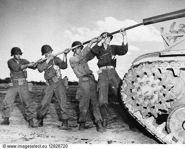 KOREAN WAR: TRAINING. Members of the New Jersey National Guard cleaning a tank cannon at Camp Drum  New York. Photographed 1952.