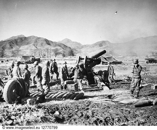 KOREAN WAR: U.S. CAVALRY. U.S. First Cavalry troops firing an eight-inch gun against enemy positions on the central Korean front  8 March 1951.