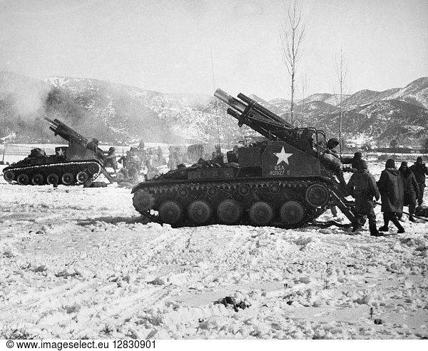 KOREAN WAR: WINTER. Allied 155mm guns fire at enemy positions in the hills near Kumyang-jang  after a patrol had contacted a concentration of Communist troops  January  date unknown.