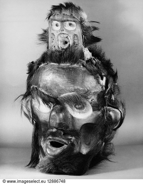 KWAKIUTL MASK. Carved wooden mask with fur representing Tsonoqua  the Wild Woman of the Woods. Kwakiutl  from British Columbia  Canada.