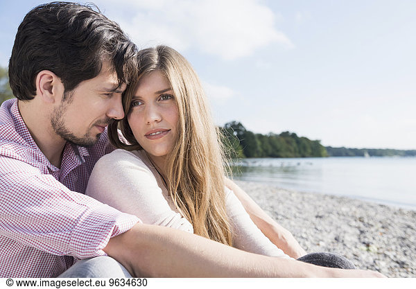 Lake beach young romantic couple portrait