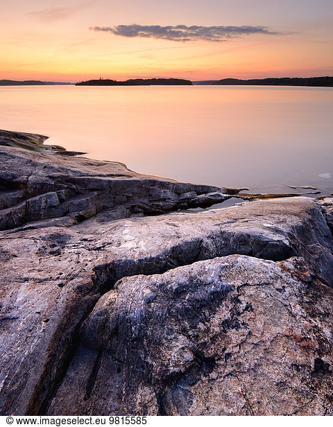Lakeside rocks on Iso Koirasaari Island at sunset  Ladoga Lake  Republic of Karelia  Russia
