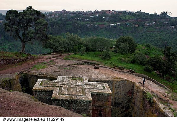 Lalibela  Amhara region  Ethiopia. Church of San George in Lalibela. The church of St. George is the principal of the eleven churches excavated in the rock of Lalibela  holy city for the Ethiopian Christians located in the north of Ethiopia. These churches are a World Heritage Site according to Unesco and represent the city of Jerusalem (they have their portal to Bethlehem  their gate to Paradise.). They are the major pilgrimage center of Ethiopia and legend has it that the angels  who worked at night  helped in their construction.