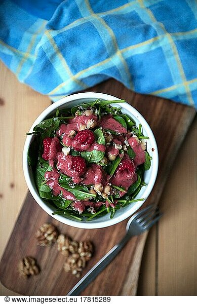 Lamb's lettuce with raspberries and vinaigrette and walnuts  food photography