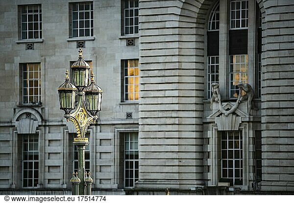 Lamp posts on Westminster Bridge with London architecture behind  cityscape of buildings and historic old lamps  taken in England during Coronavirus Covid-19 lockdown in England  UK  Europe