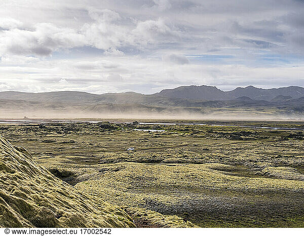 Landscape scenery with sandstorm against cloudy sky  Lakagigar  Iceland