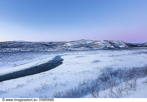 Landscape with river Storelvvassdraget in winter  Lebesby  Norway
