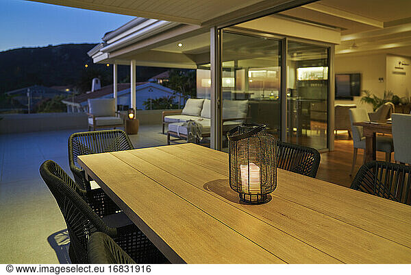 Lantern with candle on luxury home showcase patio dining table