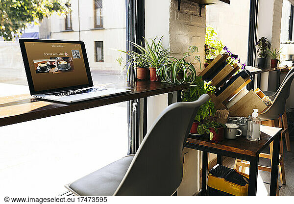 Laptop at coffee shop table