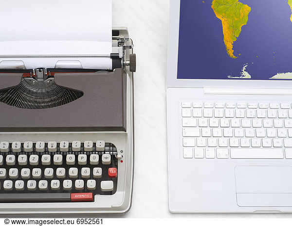 Laptop Computer and Typewriter