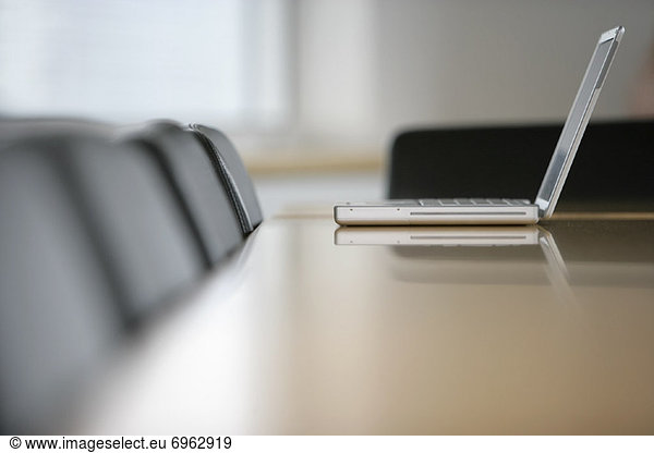 Laptop Computer on Boardroom Table