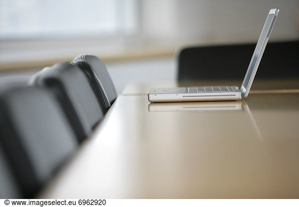 Laptop Computer on Boardroom Table