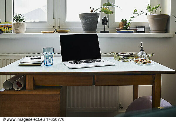 Laptop on desk at home