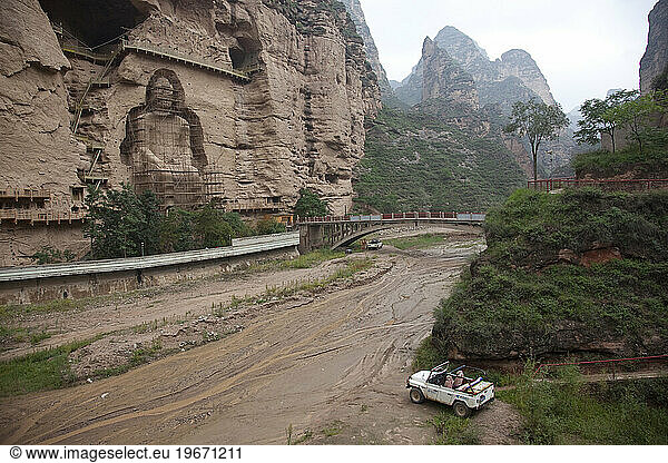 Large Buddha carved in cliffcompound wordsside at Bingling Si  Gansu Province  China