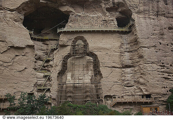 Large Buddha carved in cliffside at Bingling Si  Gansu Province  China