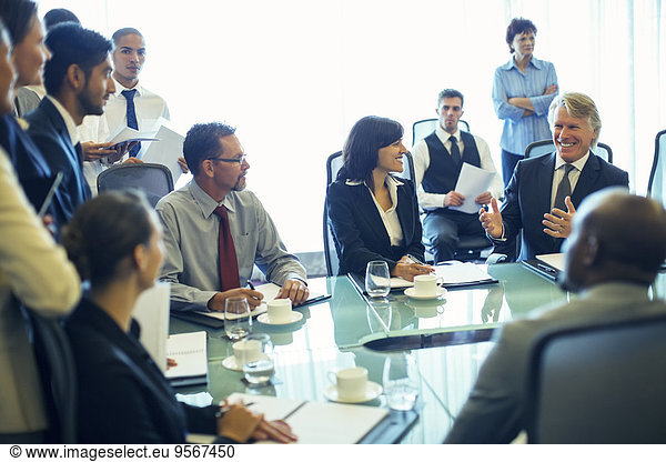 Large group of business people having meeting in conference room