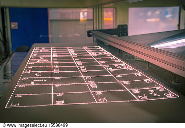 Laser test print out on print bed in laser printer in print factory