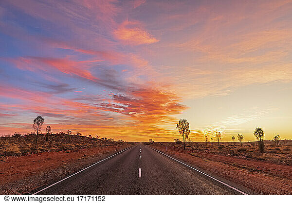 Lasseter Highway at moody sunrise  Australia