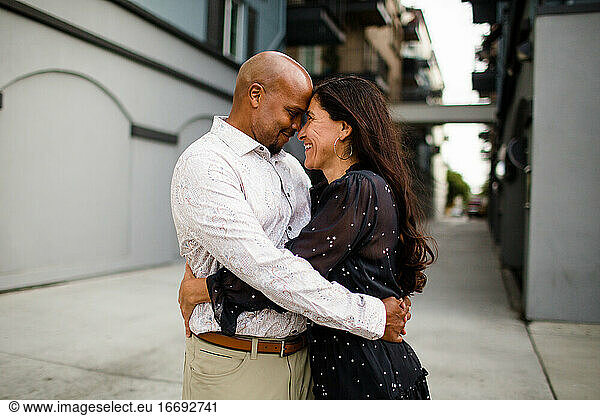 Late Forties Couple Embracing in Alley in San Diego