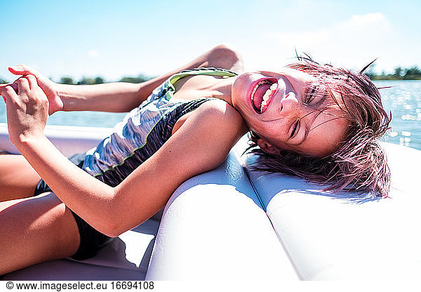 Laughing girl on a boat in hawaii