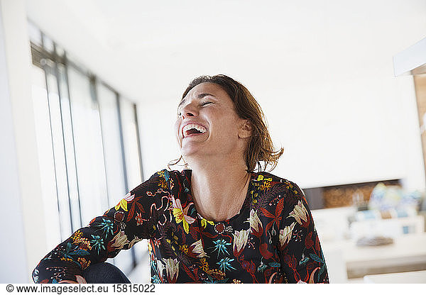 Laughing  happy brunette woman