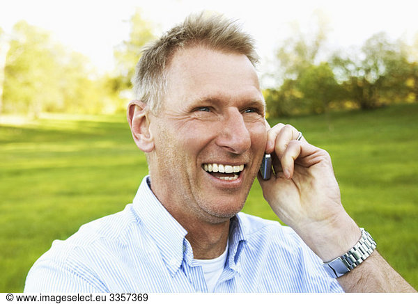 Laughing man talking in phone