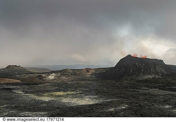 Lava spurting out of craters  sulphur deposits and cooled lava flows  active table volcano Fagradalsfjall  Krýsuvík volcano system  Reykjanes Peninsula  Iceland  Europe