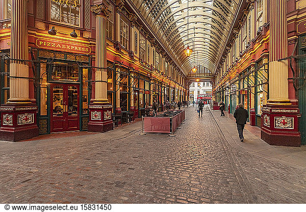 Leadenhall market from inside with few people and illuminated  London