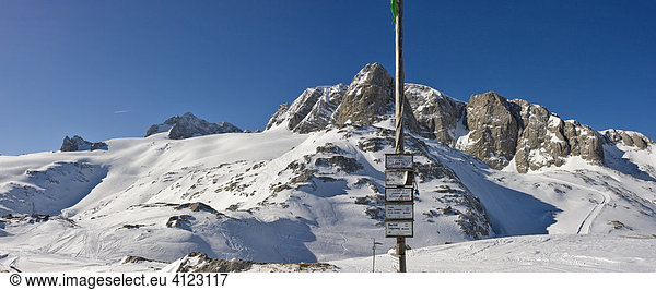 Left to right: Mts. Dirndln  Hoher Dachstein  Niederer Dachstein and  behind the directional signpost  Mt. Schoeberl  Dachstein Massif  Styria  Austria  Europe