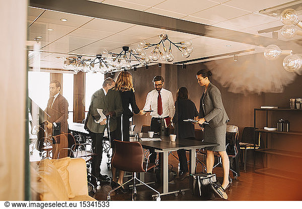 Legal colleagues leaving from board room at law office