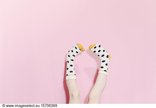 Legs of a girl wearing dotted socks