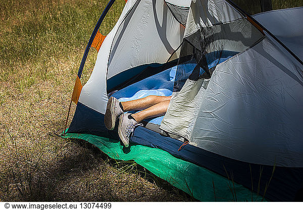 Legs of man in tent