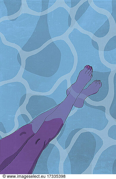 Legs of woman dipping feet in water