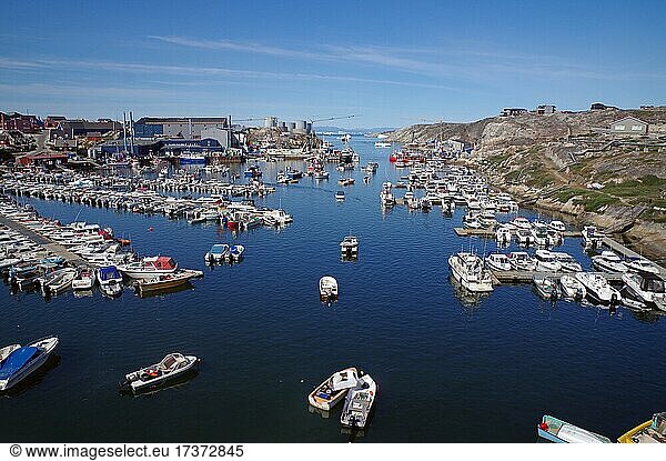 Leisure boats moored in the harbour  barren surroundings  summer  Ilulissat  Disko Bay  Greenland  Denmark  North America