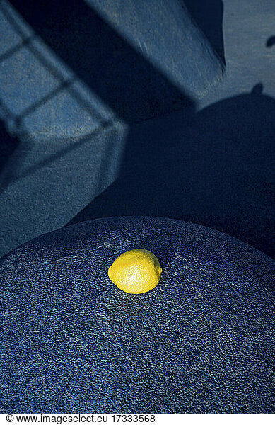 Lemon on blue surface at skateboard park during sunny day