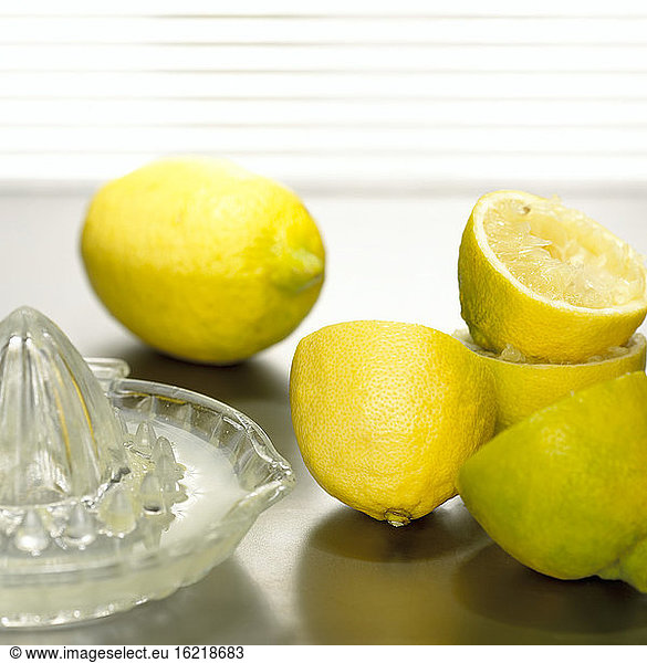 Lemons with lemon squeezer  close-up
