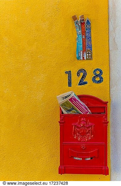 Letterbox and house number on a yellow house wall  Burano Island  Venice  Veneto  Italy  Europe