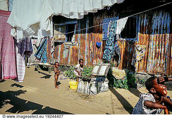 Liberia  Monrovia  report on the life of the civilian population during the 1st civil war in the Liberian capital. Children play between shacks of corrugated iron in a slum on the outskirts of the capital.
Monrovia  1994.