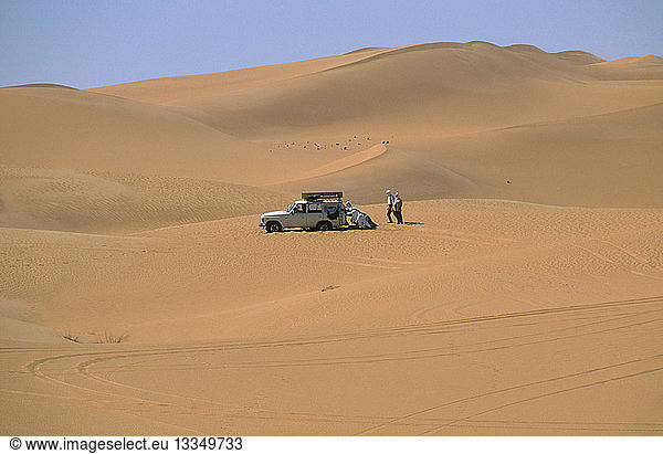 LIBYA Sahara Desert Tourists four by four vehicle stuck in Saharan sand.