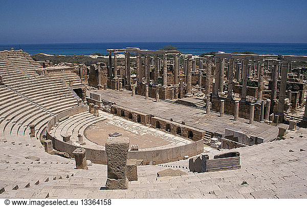 LIBYA Tripolitania Leptis Magna View over Roman amphitheatre towards the Mediterranean Sea behind.