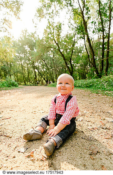 Lifestyle portrait of a baby boy on a hiking trail