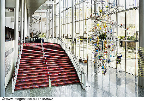 Light and airy atrium of a modern building with marble floors.