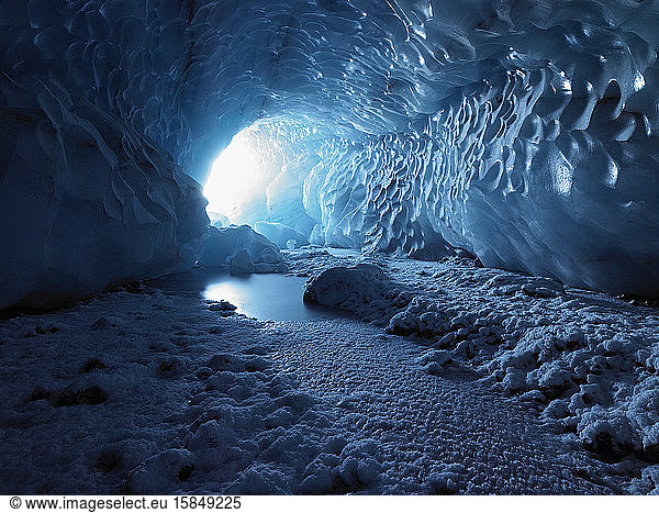 light streaming into an ice cave in Iceland
