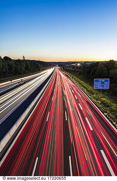 Light trails at a motorway at dusk  Leonberg  Germany