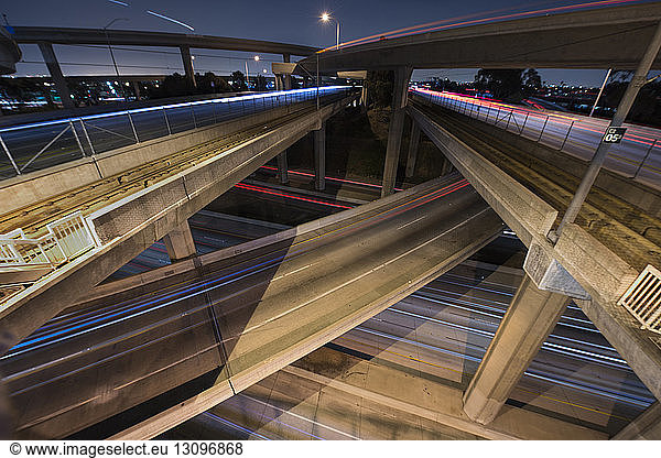 Light trails on elevated roads in city at night